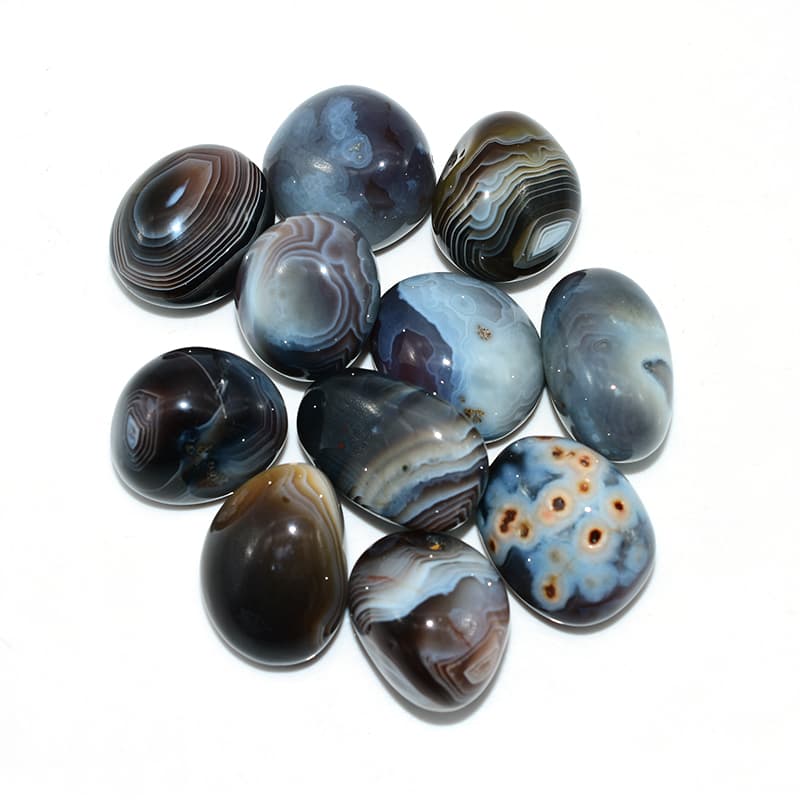 Top view of Tumbled Botswana Agate showing smooth surface and elegant color bands