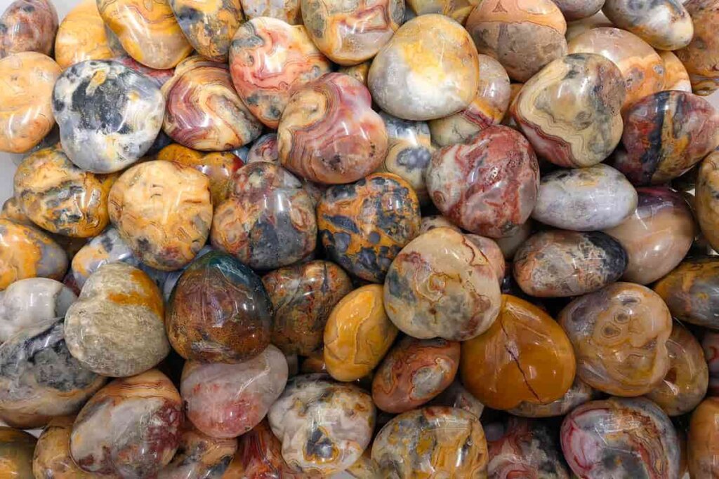 Crazy Lace Agate heart-shaped stones with colorful lace patterns, reflecting Crazy Lace Agate Meaning in emotional and symbolic designs.