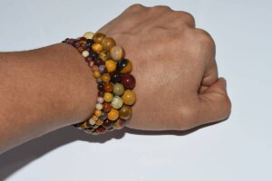 Mookaite Jasper Bracelet on wrist showing stacked bead sizes and colors