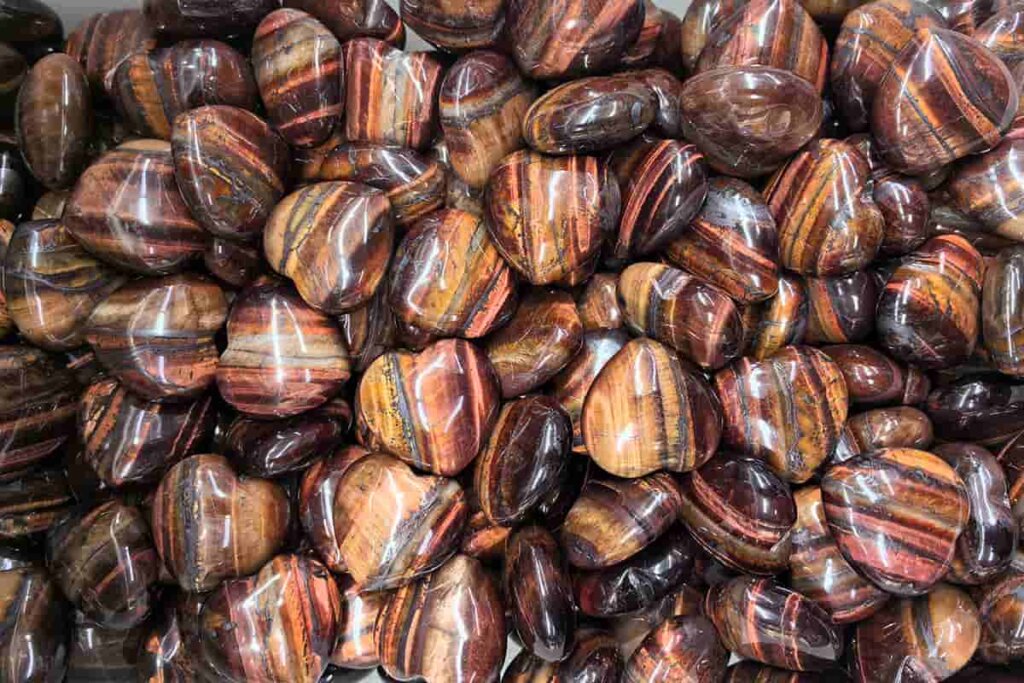 Heart-shaped Red Tiger Eye Stone, symbolizing love, strength, and the powerful Red Tiger Eye Stone Meaning, offering emotional balance and protection.