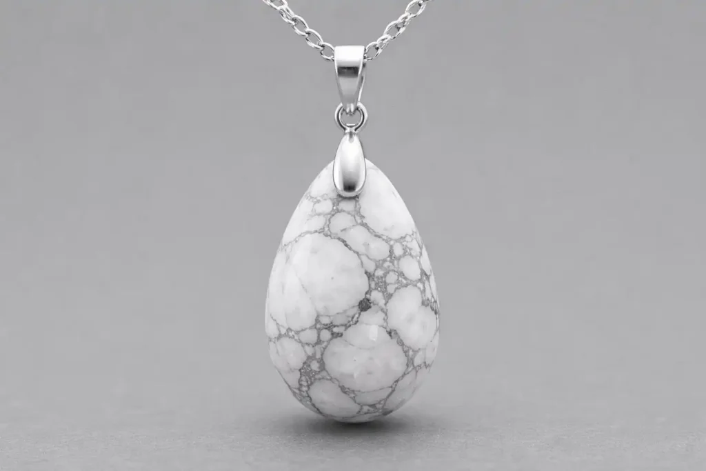 White howlite pendant with gray veining, natural howlite stone jewelry showing howlite meaning of calm and balance