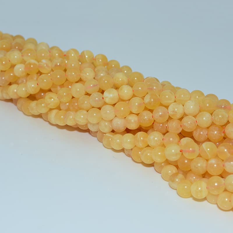 Orange Calcite Beads full strands for bulk order display and restock photos